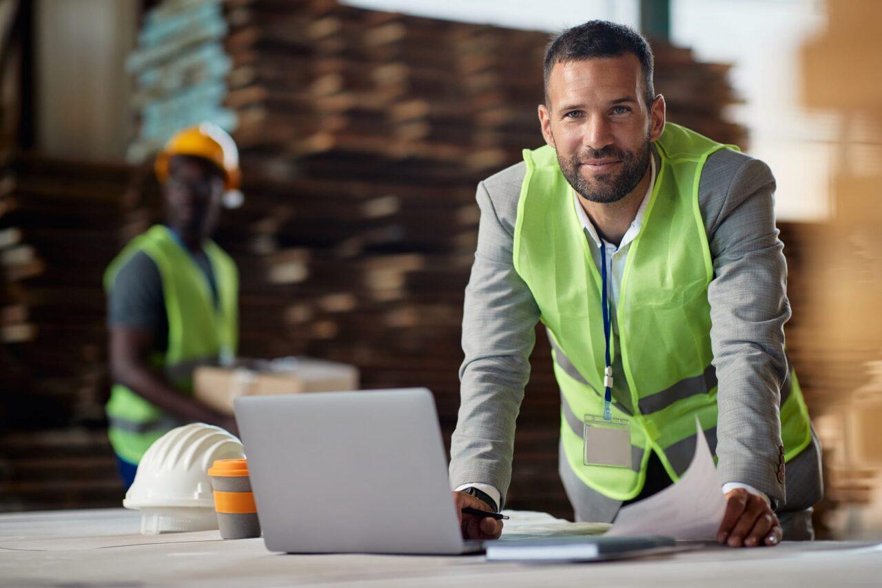 Construction professional reviewing plans at a worksite
